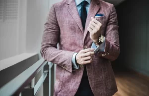 man formal suit adjusting cuffs