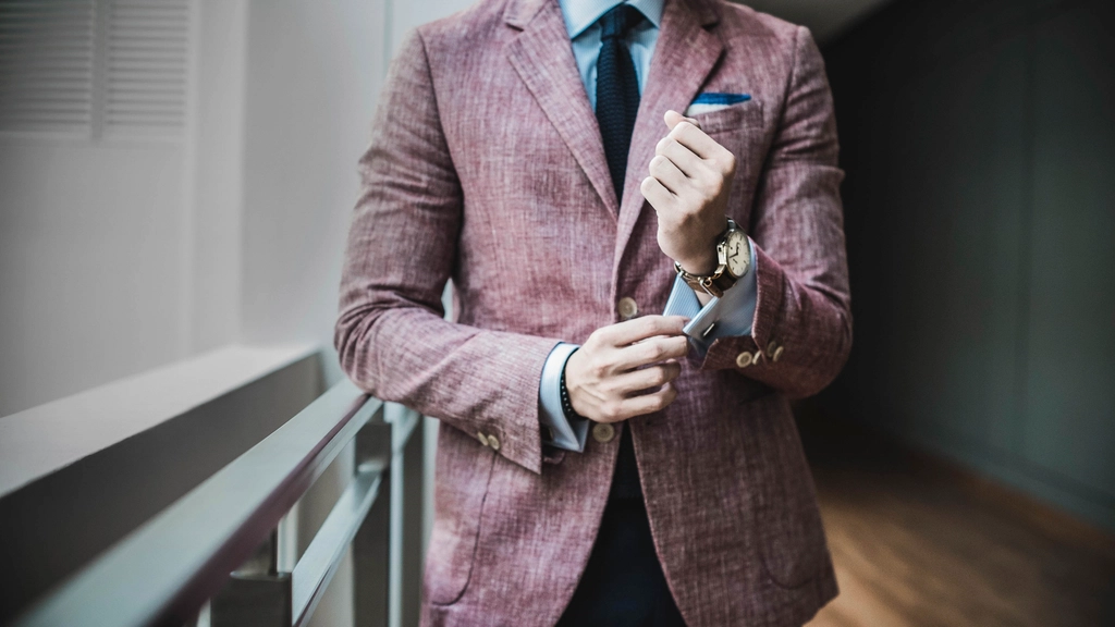 man formal suit adjusting cuffs